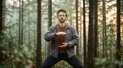 Double exposure of a practitioner holding a standing posture blended with a sage green forest